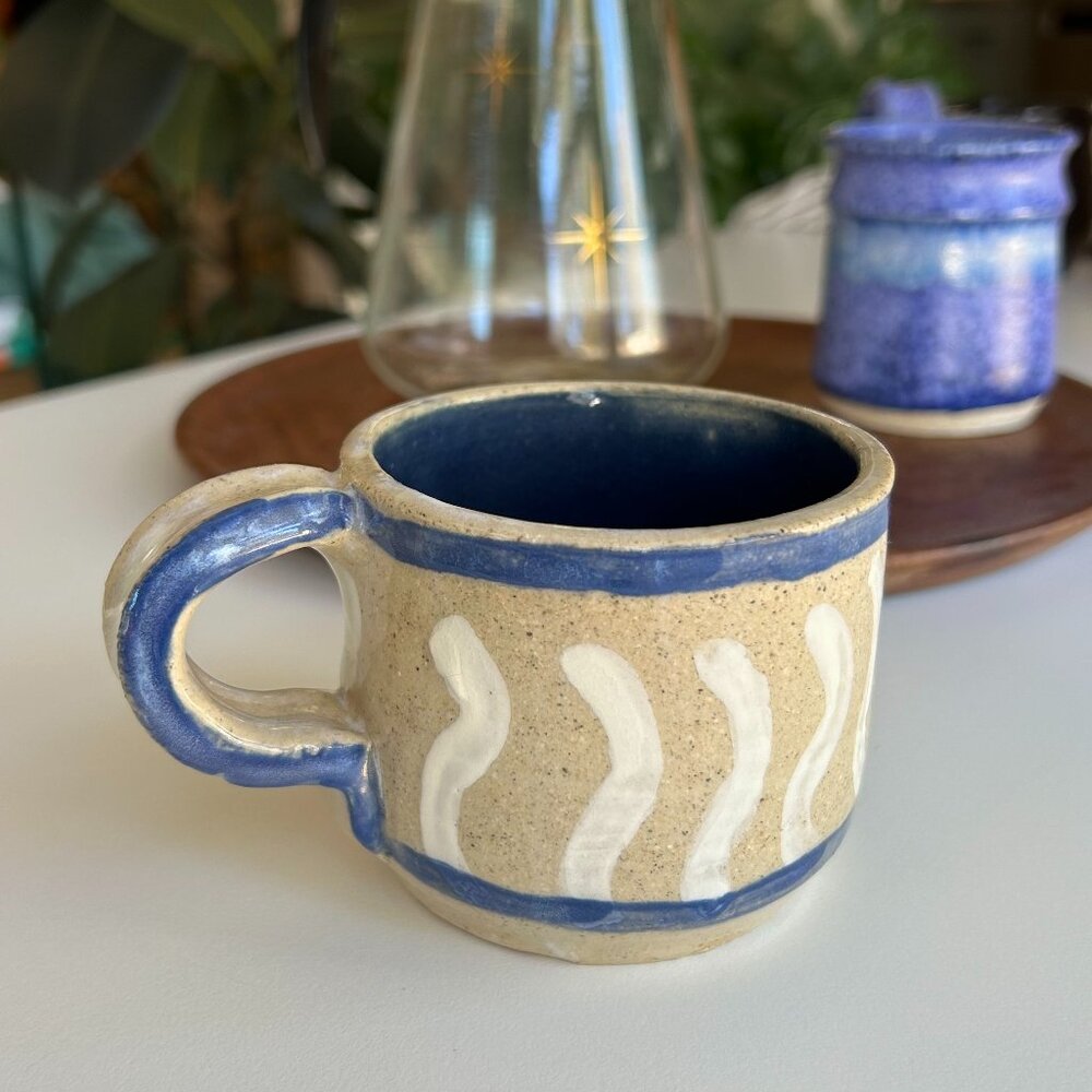 vintage handmade pottery mug blue and white